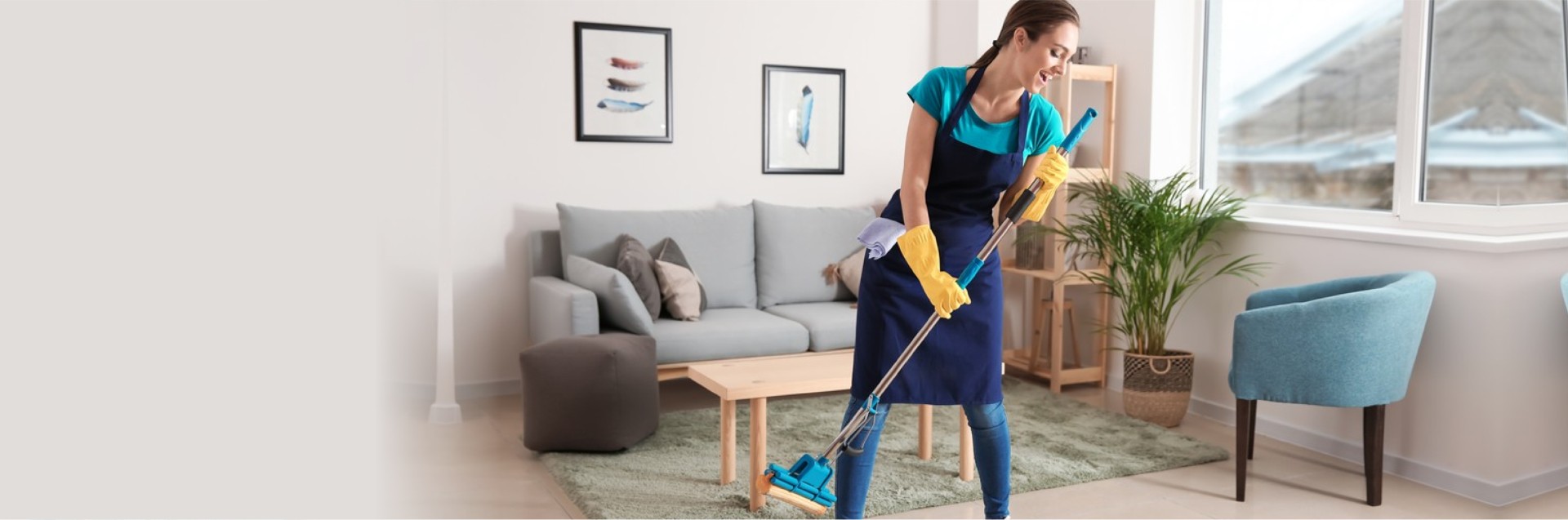 Female janitor having fun while cleaning flat